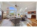 Spacious living room with hardwood floors and a cozy fireplace at 486 S Youngfield Cir, Lakewood, CO 80228