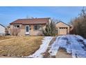 Charming single-story home with attached garage and driveway at 1760 S Yuma St, Denver, CO 80223