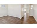 Bright hallway with wood-look flooring leading to other rooms at 27480 E Cedar Pl, Aurora, CO 80018