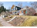 Striking modern home with contrasting colors and a welcoming brick house, plus inviting curb appeal at 3419 Stuart St, Denver, CO 80212