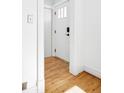 Bright foyer features gleaming hardwood floors and fresh white trim at 3419 Stuart St, Denver, CO 80212