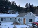Charming house with snow-covered yard at 1805 Hidden Valley Rd, Sedalia, CO 80135