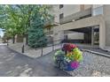 Inviting building entrance with manicured landscaping and accessible ramp for easy access at 7000 E Quincy Ave # 302, Denver, CO 80237