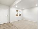 Bright living room with carpeted floor and a view of the street at 9072 Quintero St, Commerce City, CO 80022