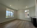 Versatile bonus room with natural light and a wet bar, perfect for entertaining or relaxation at 747 Raindance St, Erie, CO 80516
