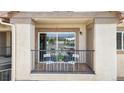 Private balcony with sliding glass door and views; furnished with table, two chairs and a potted plant at 875 E 78Th Ave # 21, Denver, CO 80229