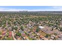 Panoramic aerial view showcasing the neighborhood and city skyline in the distance at 1742 S Alcott St, Denver, CO 80219