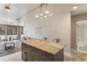 Kitchen island with seating offers a great space for cooking and entertaining at 1050 N Corona St # 206, Denver, CO 80218