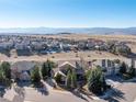 Stunning aerial view of the home nestled among other homes in the suburban community at 3125 Starling Ct, Castle Rock, CO 80109