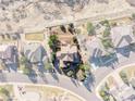 Aerial view showing the home's lot outlined; nestled on a tree-lined street at 3125 Starling Ct, Castle Rock, CO 80109