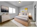 Cozy bedroom with a neutral color palette, soft lighting, and stylish furniture at 12032 Leyden St, Brighton, CO 80602