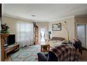 Open living room with comfortable seating, natural light, and a fireplace at 19049 E Warren Dr # 105, Aurora, CO 80013