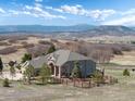 Charming single-Gathering home with a well-maintained lawn and a stunning mountain view at 1658 Glade Gulch Rd, Castle Rock, CO 80104