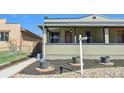 Charming bungalow home featuring covered front porch and updated paint at 3946 Perry St, Denver, CO 80212