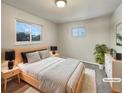 Virtually staged bedroom with light walls and a wood bed frame at 3569 W 89Th Ave, Westminster, CO 80031