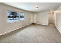 Bright and airy living room with neutral carpeting and large windows at 3569 W 89Th Ave, Westminster, CO 80031