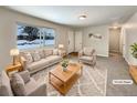 Virtually staged living room featuring neutral tones and ample natural light at 3569 W 89Th Ave, Westminster, CO 80031