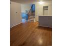 Spacious living room with hardwood floors, featuring a staircase leading to the upper level, and a bright, open layout at 2995 S Whiting Way, Denver, CO 80231