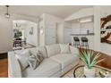 Cozy living room featuring hardwood floors and a stylish couch at 12335 E 2Nd Dr, Aurora, CO 80011