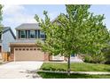 Charming two-story brick home with a well-manicured lawn and a spacious two car garage at 5674 S Ingalls St, Littleton, CO 80123