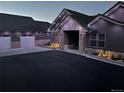 Attractive single-Gathering home featuring stone accents, recessed lighting and a three-car garage at 5489 Country Club Dr, Larkspur, CO 80118