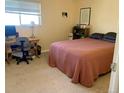Bedroom with neutral decor, carpeted floors, and a comfortable bed at 3161 Madison Ave # R313, Boulder, CO 80303