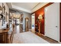 Inviting entryway featuring hardwood floors, decorative accents, an area rug and a neutral color palette at 18340 W 85Th Dr, Arvada, CO 80007