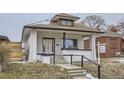 Charming front exterior of a white two-story home featuring a front porch with stairs and a 'for sale' sign at 3532 N Vine St, Denver, CO 80205