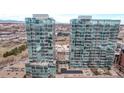 Stunning aerial view of modern glass high-rise buildings in an urban setting, close to downtown with mountain views at 1700 Bassett St # 820, Denver, CO 80202