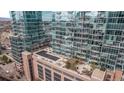 Stunning aerial view of modern high-rise buildings with reflective glass and rooftop lounge at 1700 Bassett St # 820, Denver, CO 80202