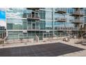 Modern condo building featuring a covered pool, balconies, and contemporary architectural design at 1700 Bassett St # 820, Denver, CO 80202