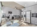 Modern living space with hardwood floors, dining area, stainless appliances, and open layout at 1700 Bassett St # 820, Denver, CO 80202