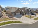 Wide aerial view showcases houses with manicured lawns and driveways in a well-planned neighborhood at 27234 E Quarto Ave, Aurora, CO 80016