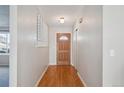 Entryway with wood floors and closet at 19322 E Eldorado Dr, Aurora, CO 80013
