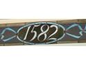 Close up of the stained glass address above the front door at 1582 Steele St, Denver, CO 80206