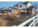 Spacious backyard patio featuring a covered outdoor kitchen and dining area at 10883 E 163Rd Ct, Brighton, CO 80602