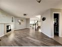 Open living space with wood floors leads to stairs, bathroom and connects seamlessly at 21993 E Jamison Pl, Aurora, CO 80016
