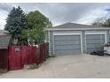Spacious two-car garage with concrete driveway and traditional doors at 188 S Dale Ct, Denver, CO 80219