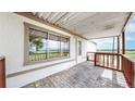 Charming covered patio featuring brick pavers and offering plenty of natural light at 8509 Colorado Ct, Denver, CO 80229