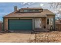 Attractive single-Gathering home with a two-car garage, a well-kept lawn, and a welcoming entrance at 6758 W Louisiana Pl, Lakewood, CO 80232