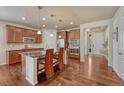 Beautiful kitchen with granite countertops, stainless steel appliances, and hardwood floors at 8054 E 152Nd Dr, Thornton, CO 80602