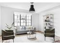 Spacious living room featuring a comfortable sofa and large windows at 3408 W 17Th Ave, Denver, CO 80204