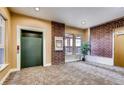 A view of the lobby, showcasing warm tones, stylish carpeting, elevator and attractive decor at 10184 Park Meadows Dr # 1317, Lone Tree, CO 80124