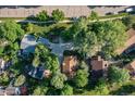 Aerial shot of homes with mature trees, manicured lawns and spacious driveways at 6396 Twin Lakes Rd, Boulder, CO 80301