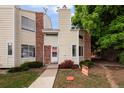Charming two-story townhouse with brick accents and a well-maintained front yard at 8126 Gray Ct # 499, Arvada, CO 80003