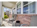 Relaxing front porch view with comfortable seating, perfect for enjoying quiet moments outdoors at 7961 E 131St Ave, Thornton, CO 80602
