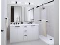 Clean bathroom design featuring a dual vanity, modern fixtures, and a walk-in shower with sleek glass enclosure at 5780 W 92Nd Ave, Westminster, CO 80031