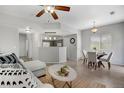 Open floor plan featuring a cozy living area seamlessly connected to the dining and kitchen spaces at 9080 Gale Blvd # 4, Thornton, CO 80260