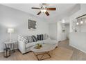 Inviting living room featuring a ceiling fan and a stylish Denver-themed art piece at 9080 Gale Blvd # 4, Thornton, CO 80260