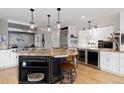 Spacious kitchen featuring an island with a granite countertop and stainless steel appliances at 1952 Columbine Ct, Golden, CO 80401